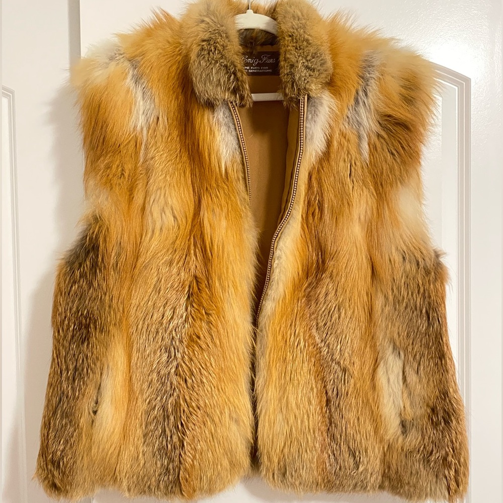 This is a Henig furs: fur for four generations vest jacket